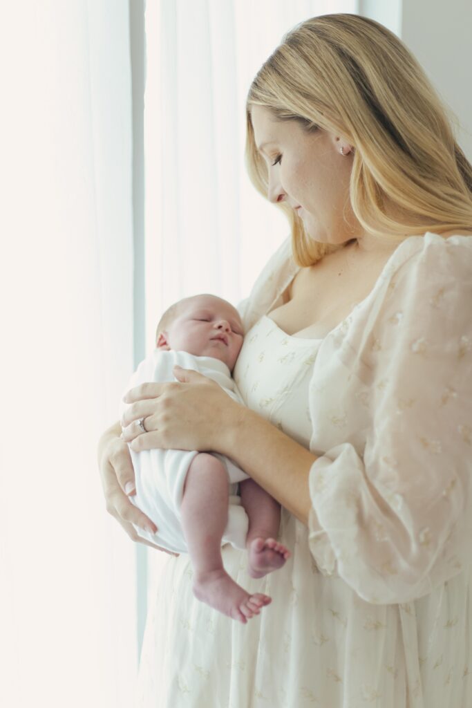 mother holding newborn baby