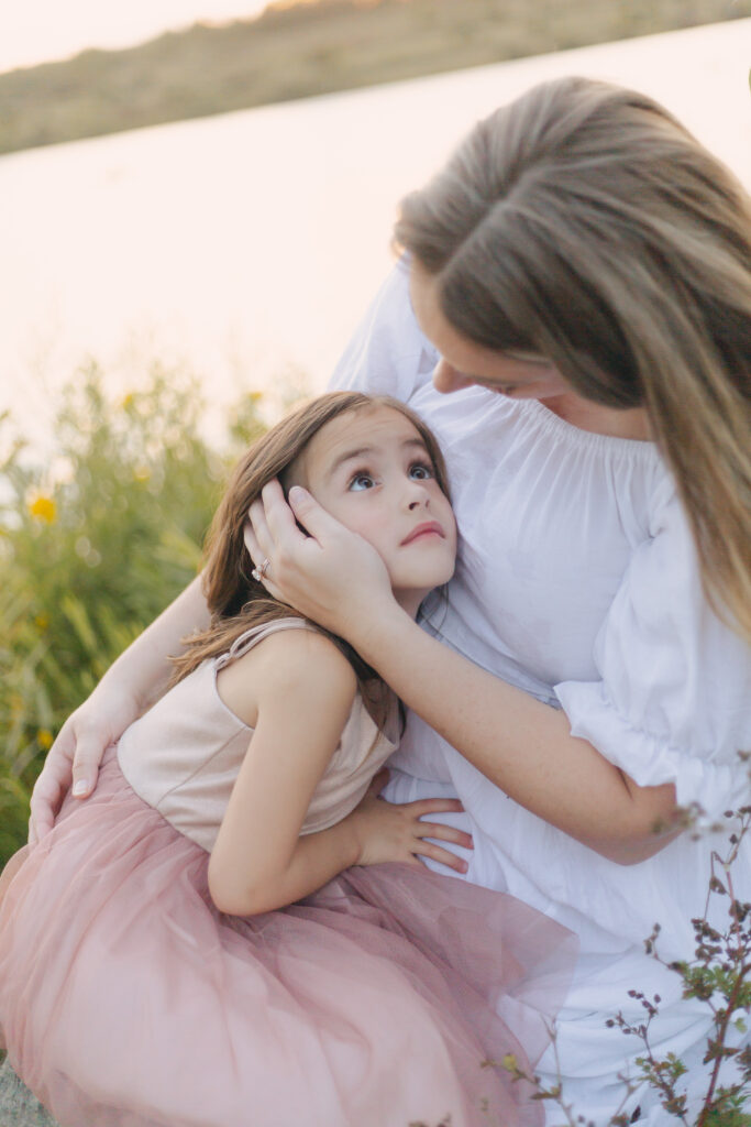 Mom holding daughter