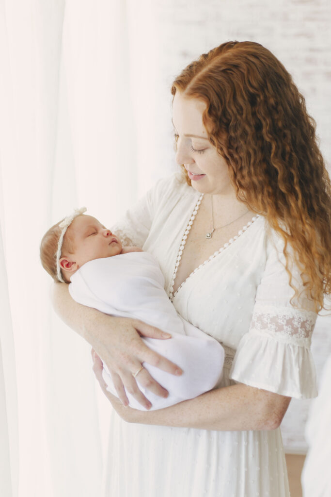 mom holding newborn baby