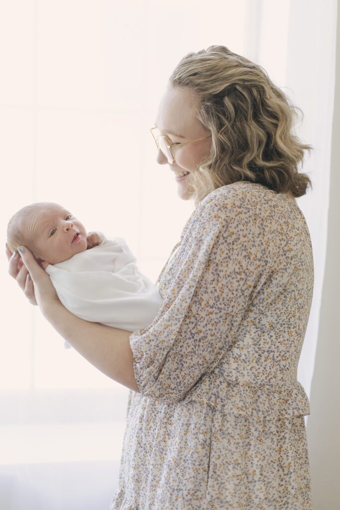 newborn baby posing with mom