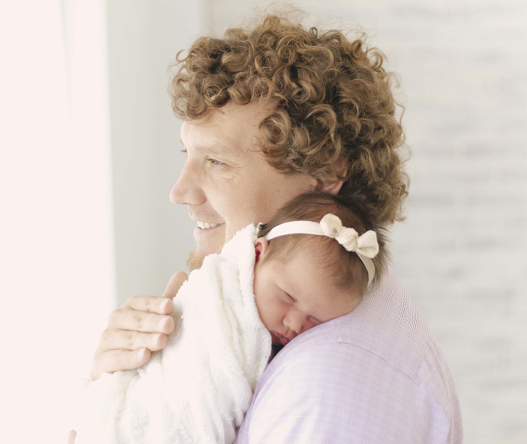 dad holding newborn baby