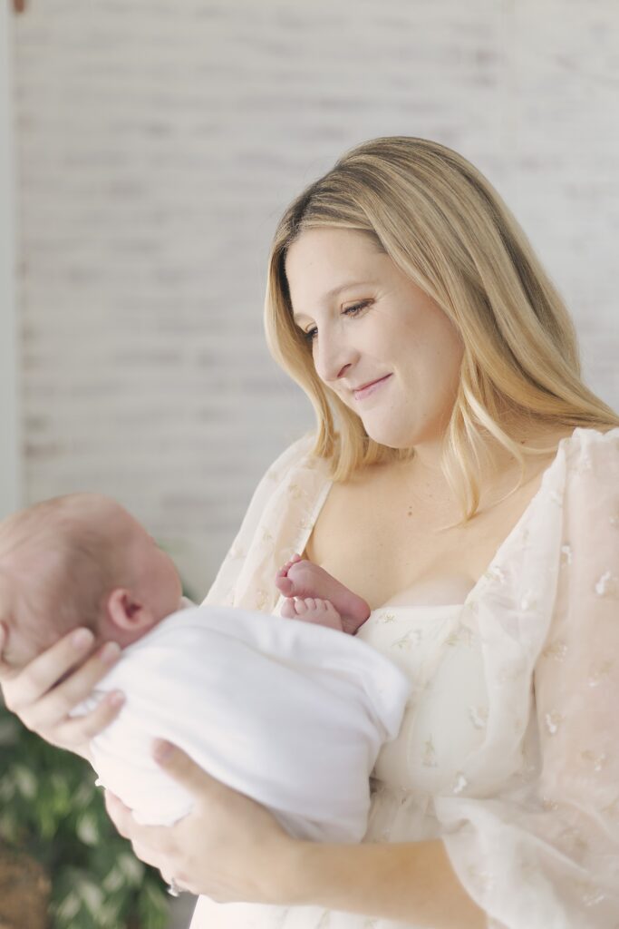 newborn baby posing with mom