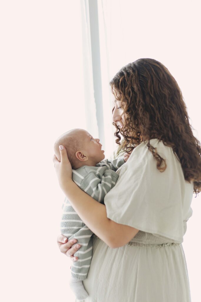 mom holding newborn baby