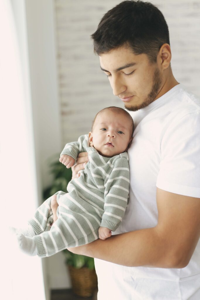 dad holding newborn baby