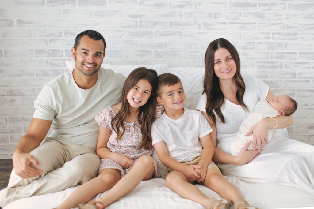 family posing together during their newborn photography session in omaha, nebraska